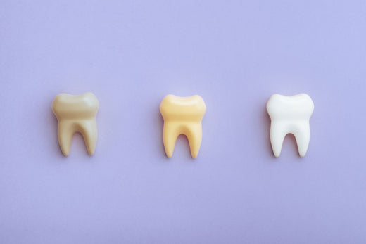 WHAT CAUSES TEETH TO TURN YELLOW?