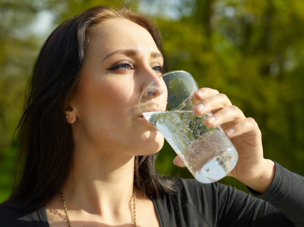 Woman drinking sparkling water